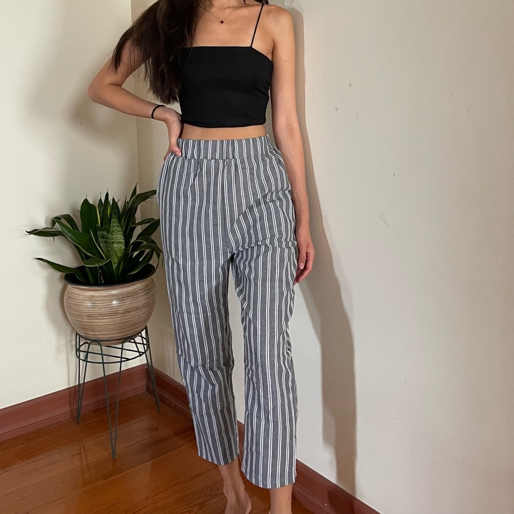 Grey and white striped pants, tag says size M (but fits like a Small)